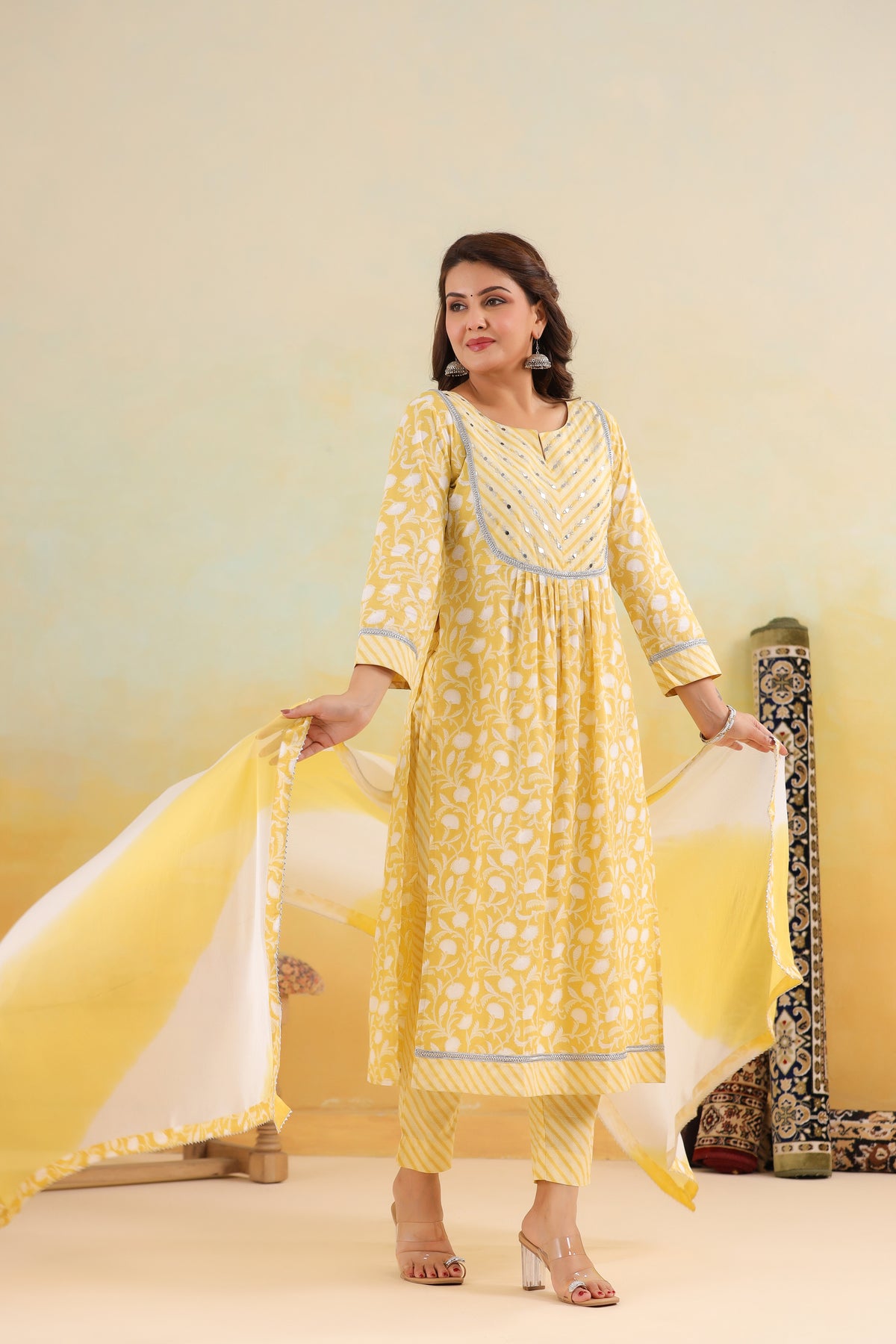 Yellow floral print cotton kurta set with silver embroidery, paired with matching palazzo and dupatta for women