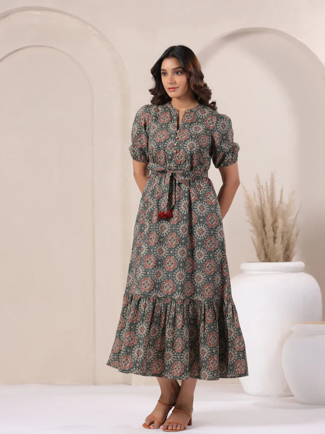 Woman in floral print cotton kurta dress with tie waist, perfect for daily wear or celebrations