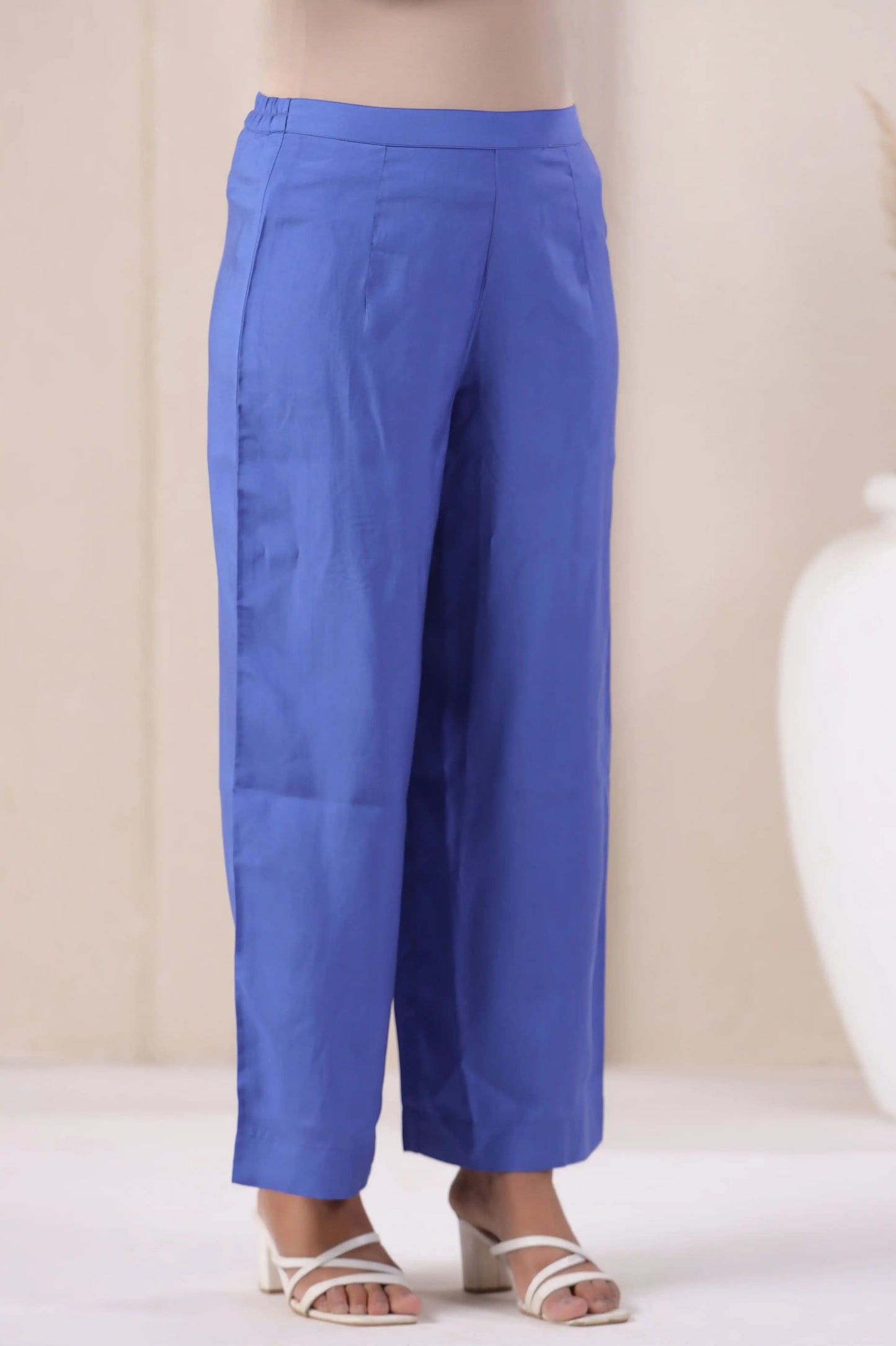 Blue cotton wide-leg pants for women, paired with white heels, ideal for casual or office wear.