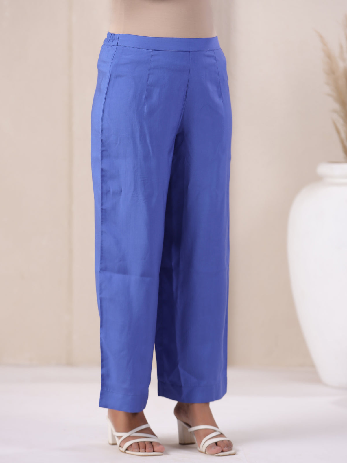 Blue cotton wide-leg pants for women, paired with white heels, ideal for casual or office wear.