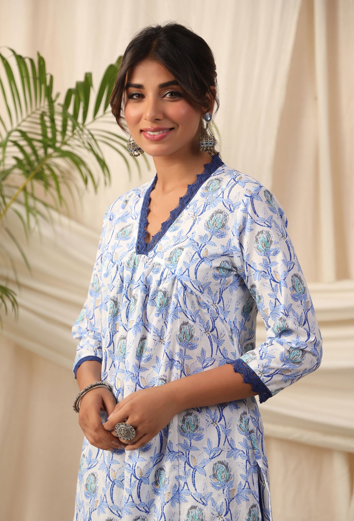 Blue floral print cotton kurta with lace trim, elegant women's wear for daily or festive occasions