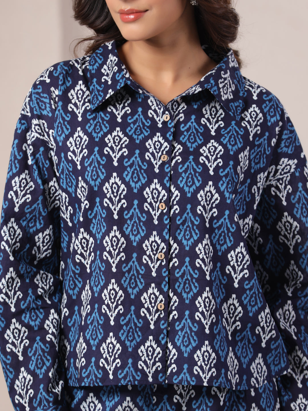 Navy blue cotton kurta with white and light blue ikat print, button front, for women's daily or festive wear