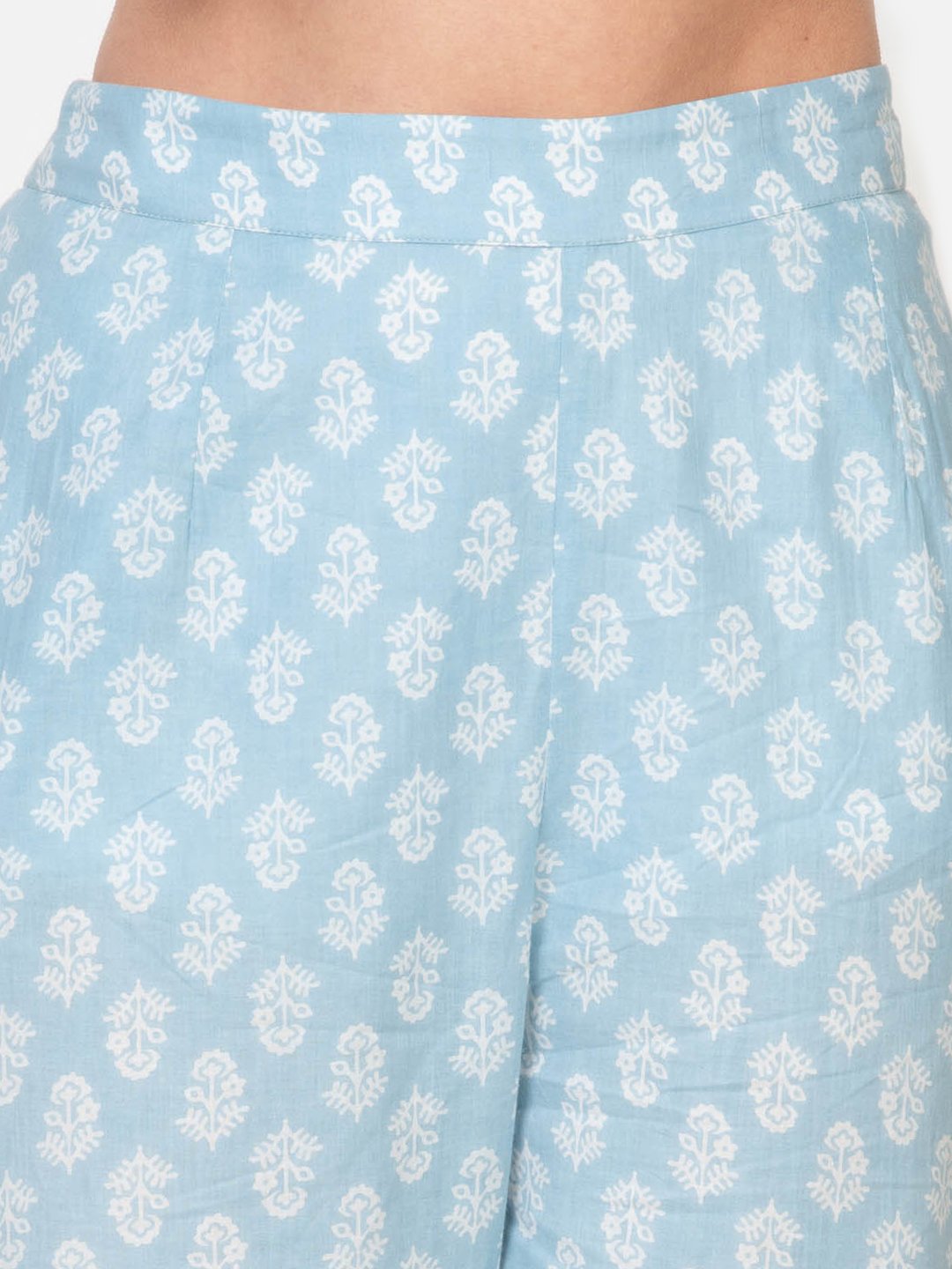 Light blue cotton palazzo pants with white floral block print, ideal for women's casual or office wear
