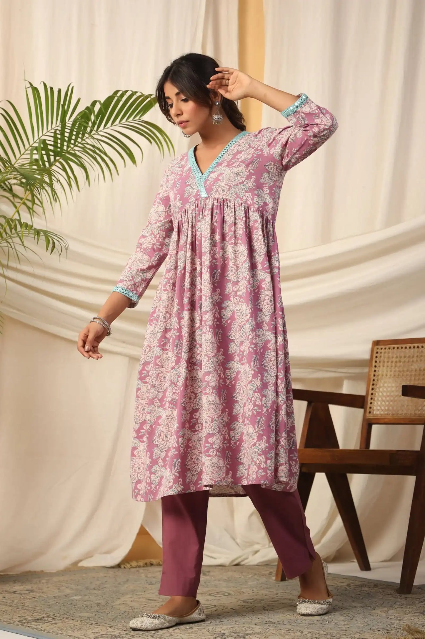 Pink floral print cotton kurta with mint trim, paired with maroon pants for women's daily wear