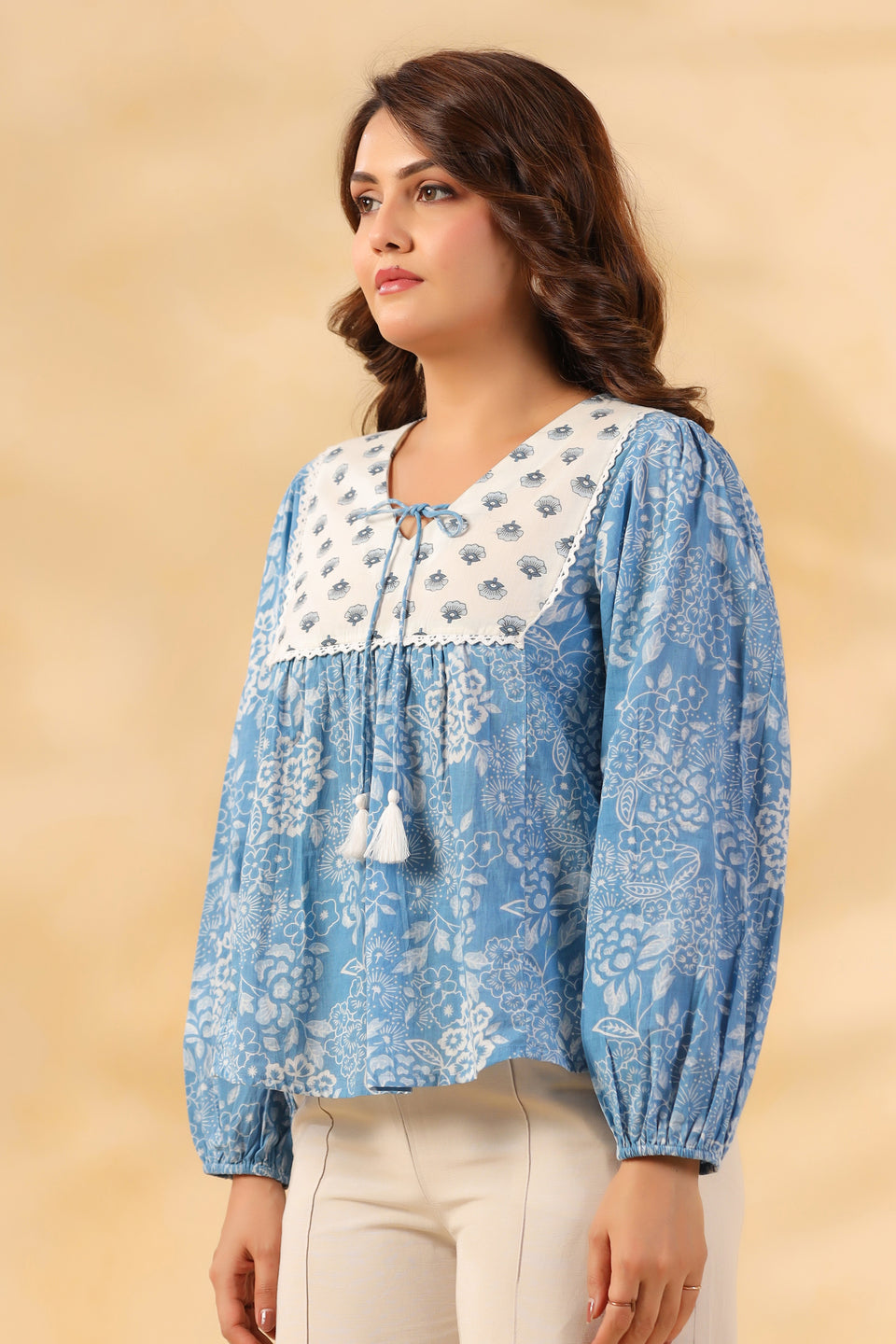 Blue floral print cotton kurta with white yoke and tassels, ideal for daily wear or office
