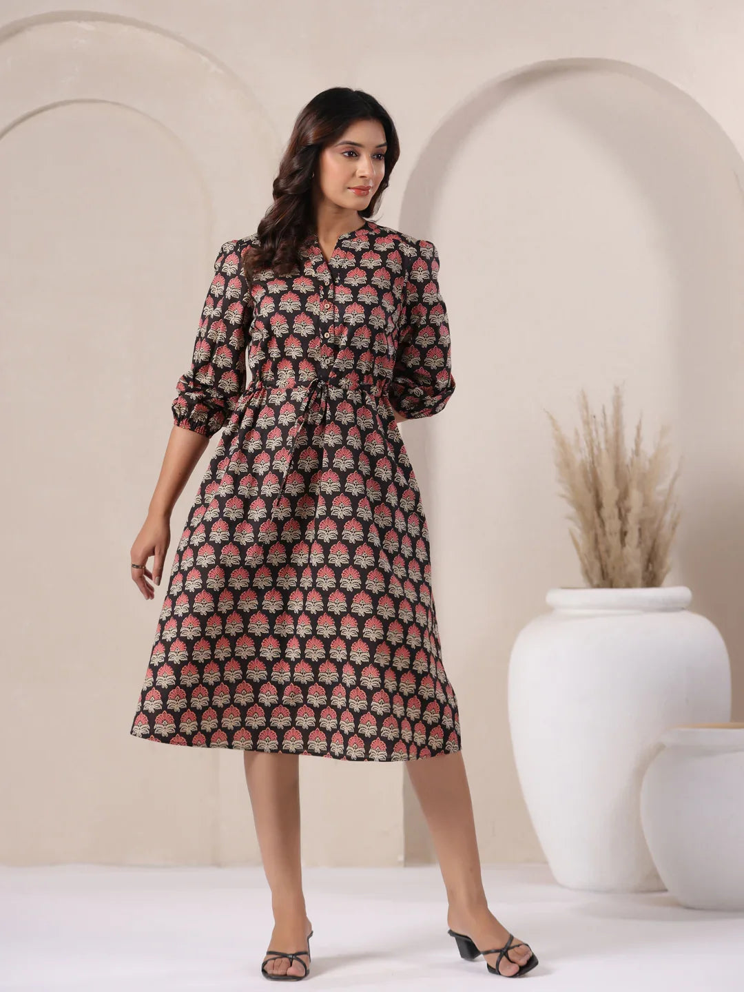 Woman in black cotton kurta dress with pink floral print, elegant daily wear style