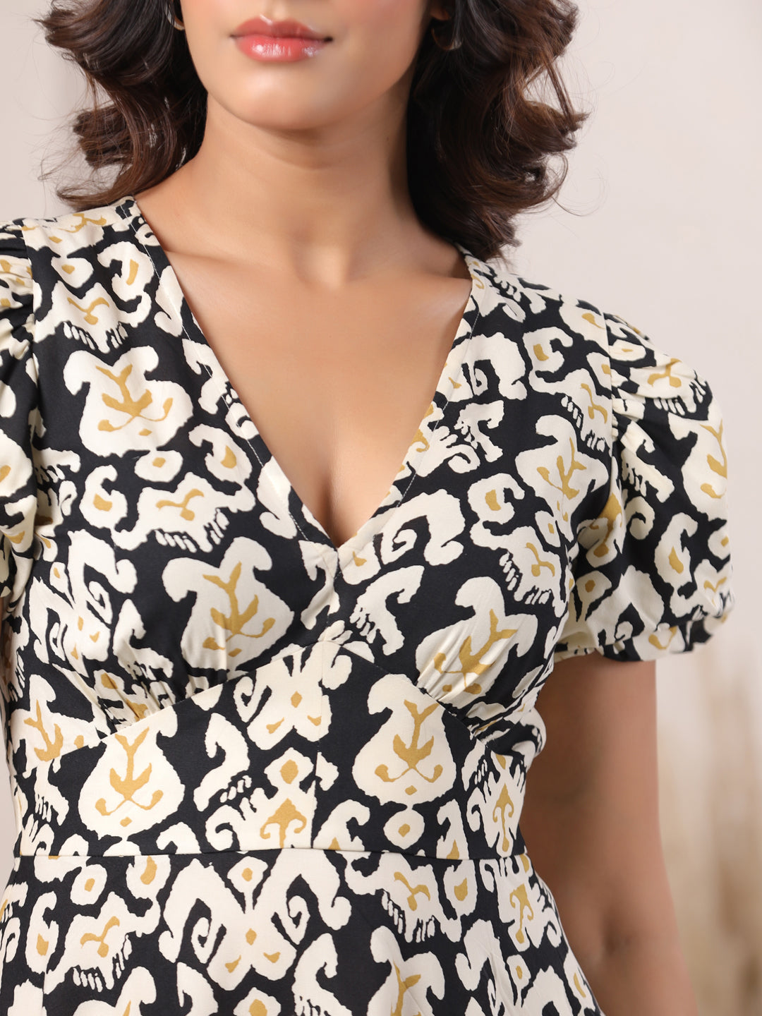 Black and white ikat print kurta with puff sleeves, elegant V-neck design for women