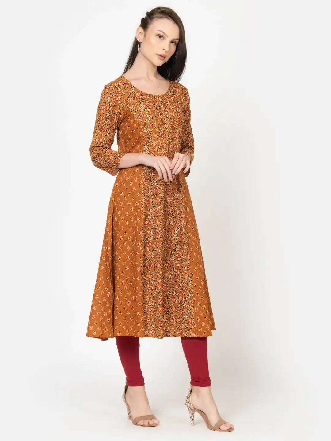Women's mustard floral print cotton kurta with red leggings, elegant daily wear outfit