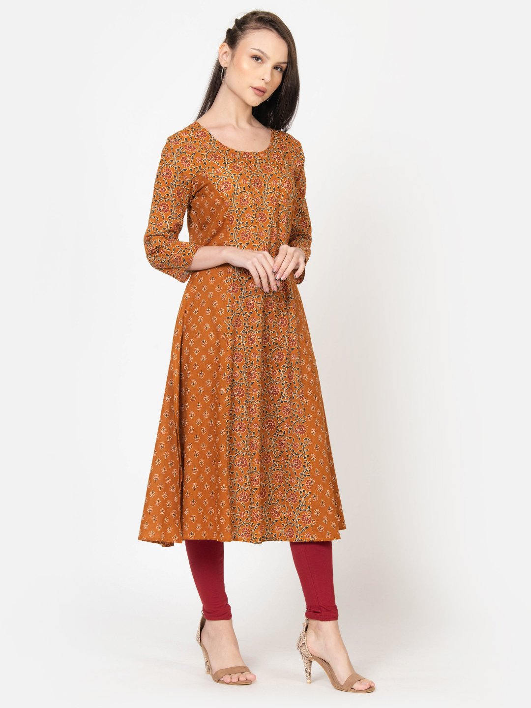 Women's mustard floral print cotton kurta with red leggings, elegant daily wear outfit