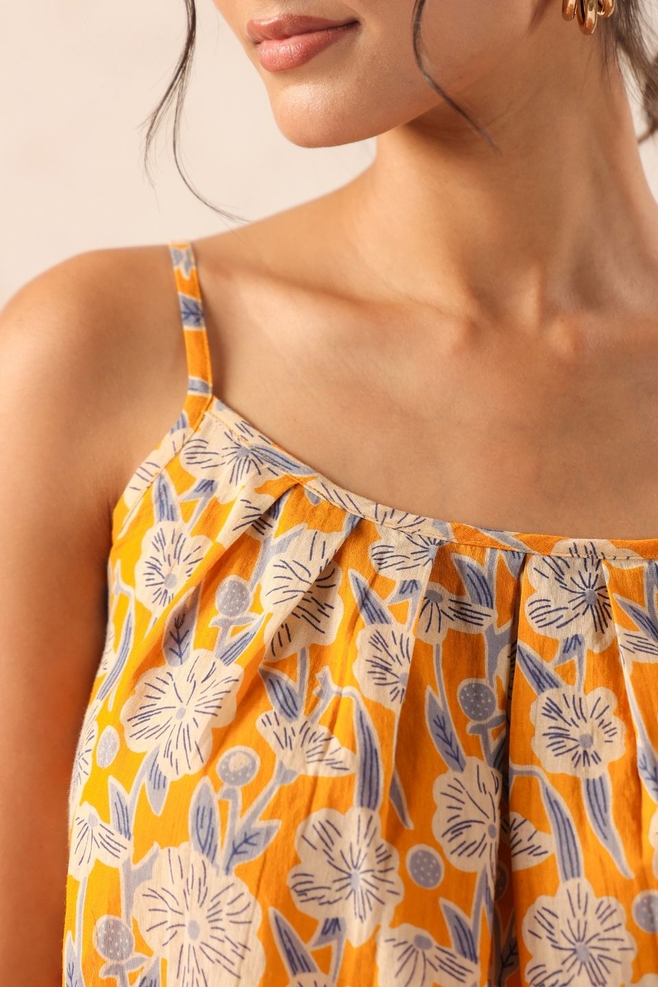 WomanwearingyellowfloralstrappytopcasualsummeroutfitSleevesdeatils - VyomTara