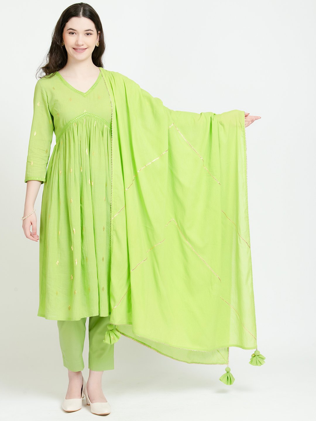 Lime green cotton kurta set with embroidered dupatta and tassels, perfect for daily wear or celebrations