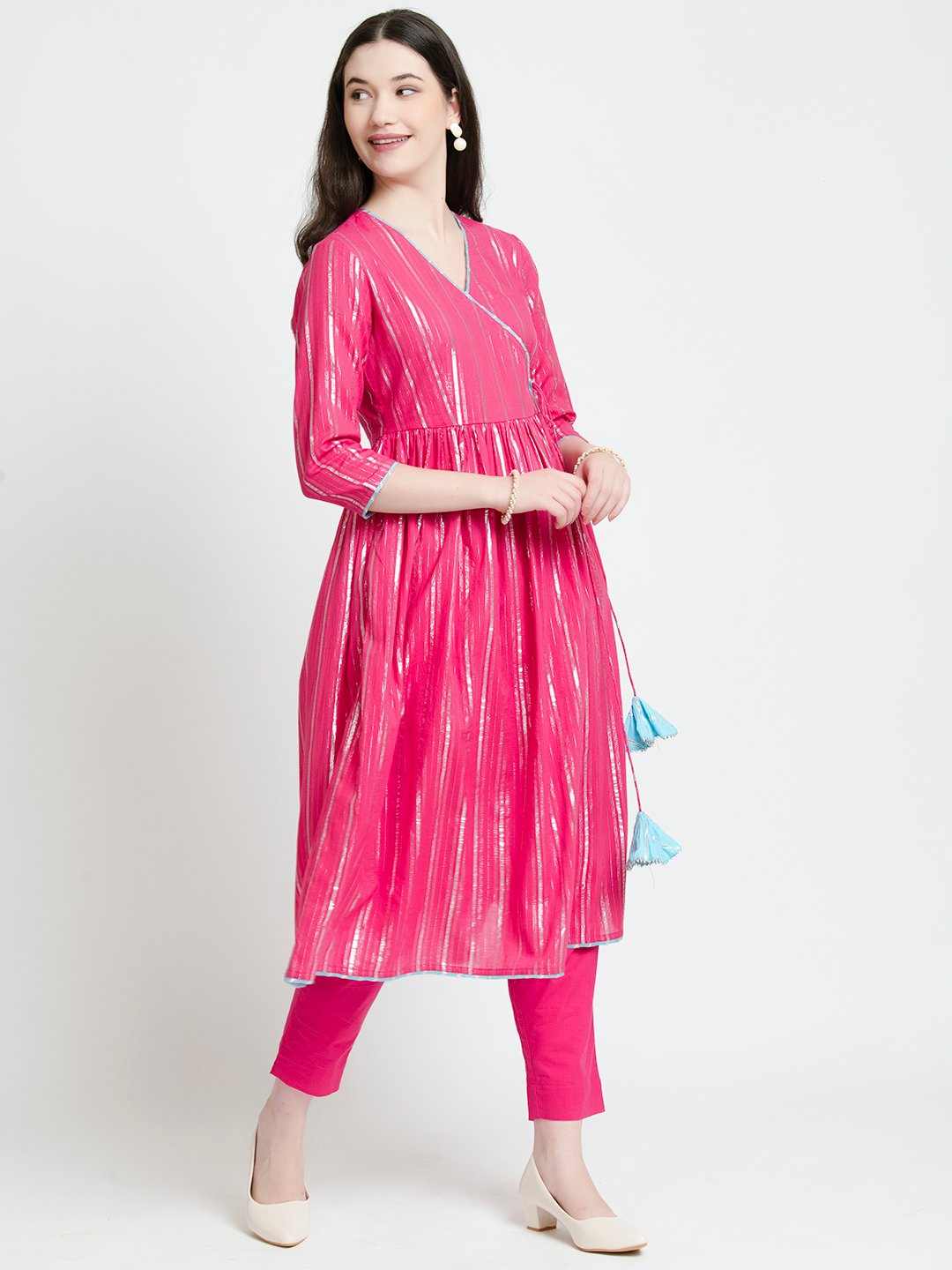 Pink cotton kurta set with shimmer stripes, paired with matching pants and tassel bag for women