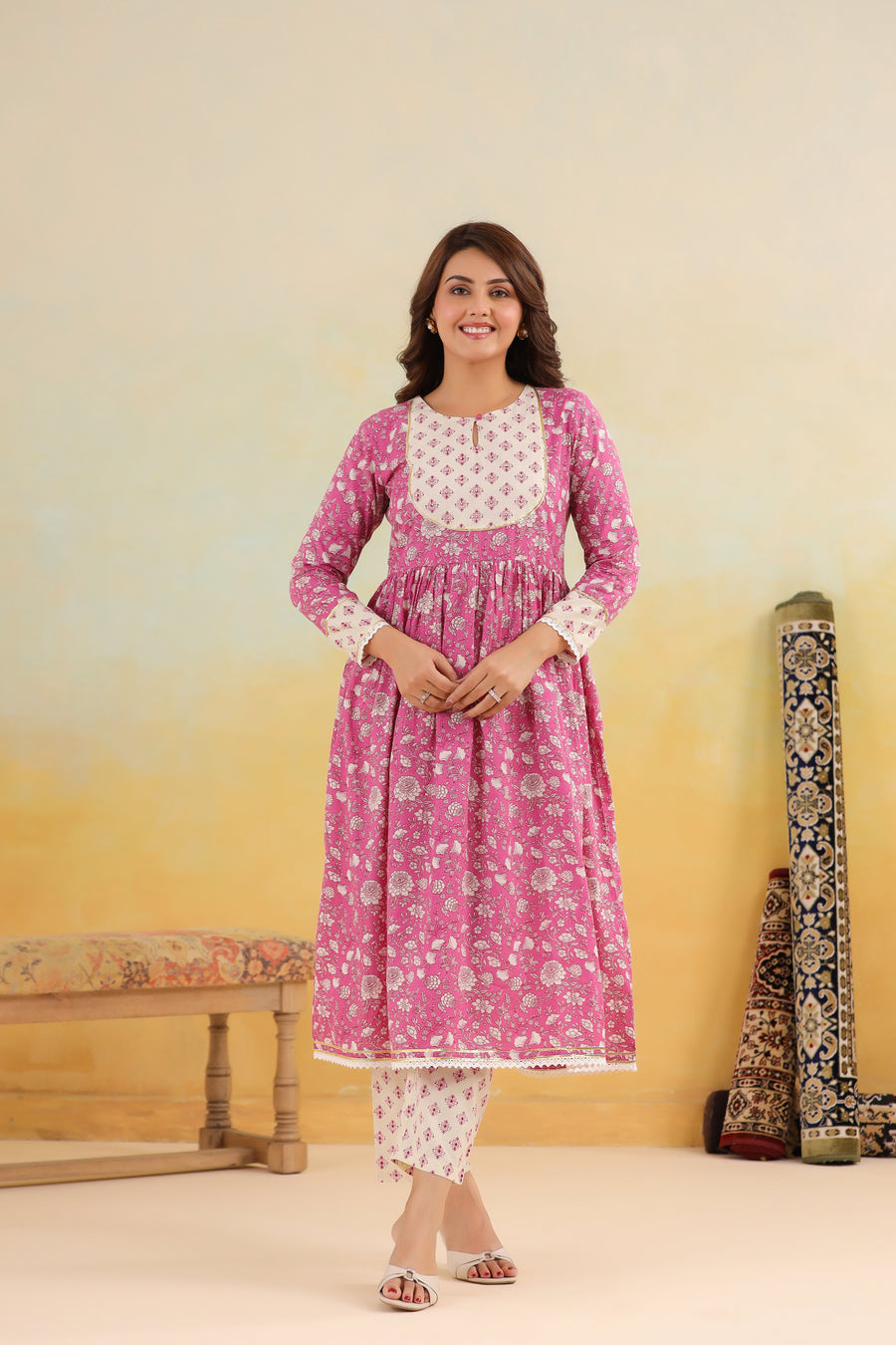 Pink floral print cotton kurta set with white contrast yoke and pants, elegant for daily wear or celebrations