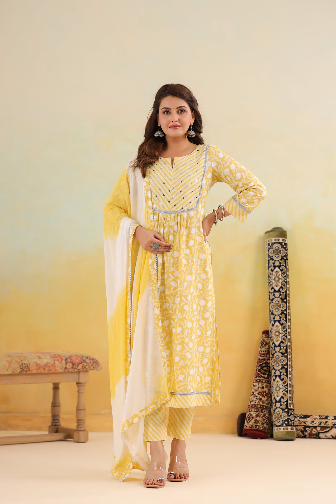 Yellow floral print cotton kurta set with white dupatta, perfect for daily wear or celebrations