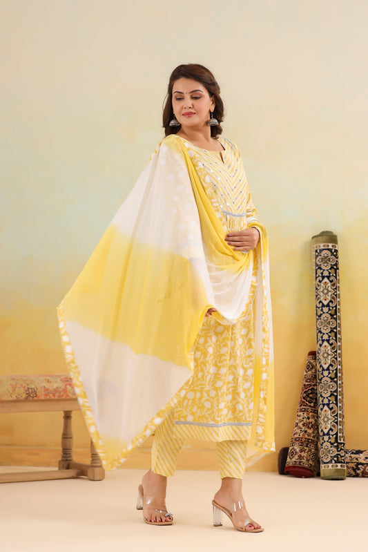 Woman in a yellow and white traditional outfit standing against a gradient background