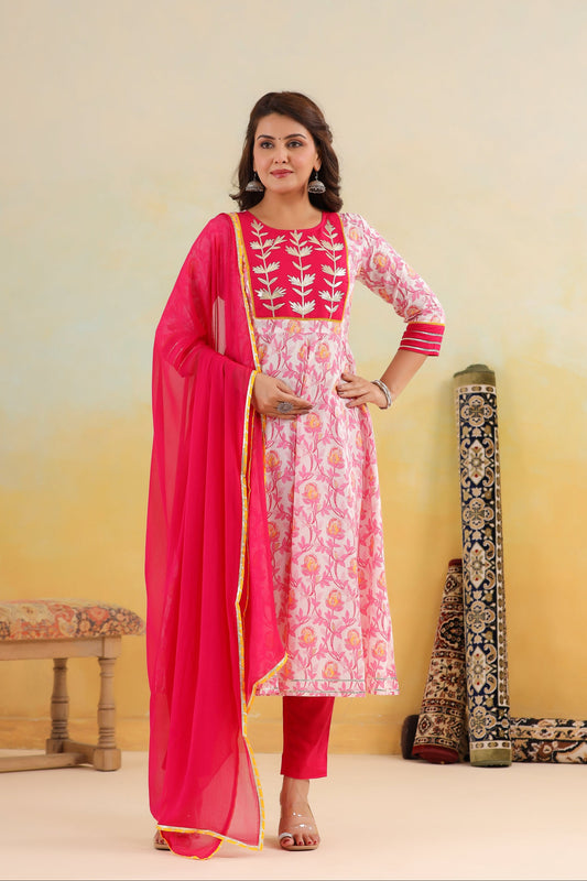 Woman wearing a pink traditional outfit with a yellow background