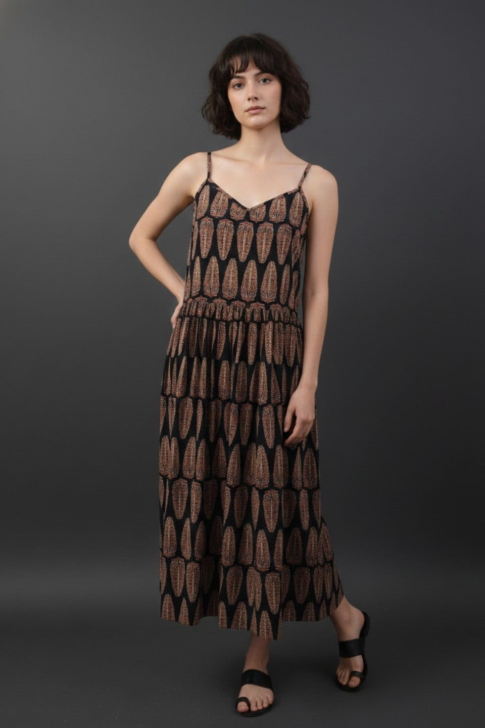Side profile black geometric printed midi dress cotton strappy V-neck fit and flare style