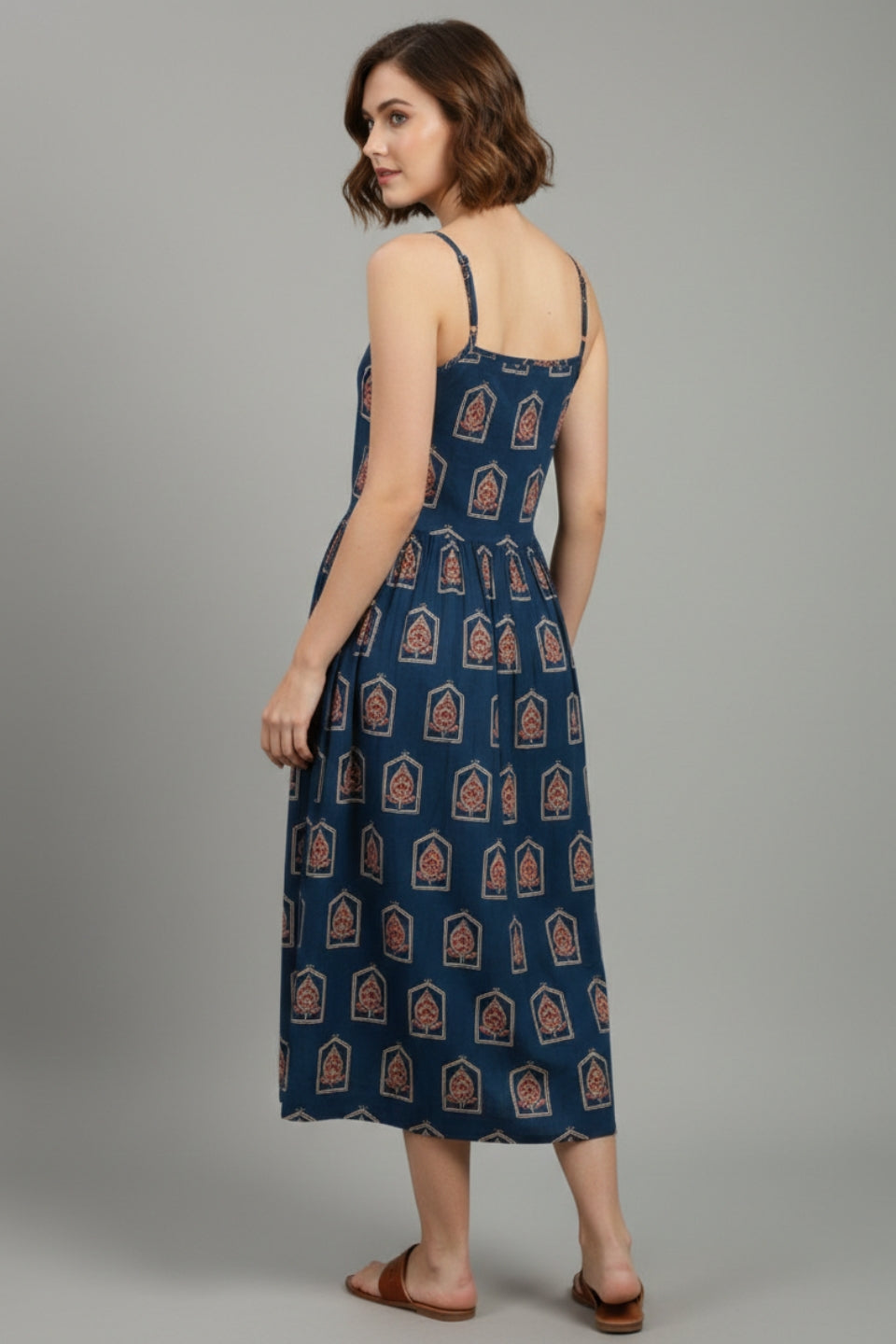 Woman wearing indigo Ajrakh printed midi dress front view cotton fit and flare casual strappy dress