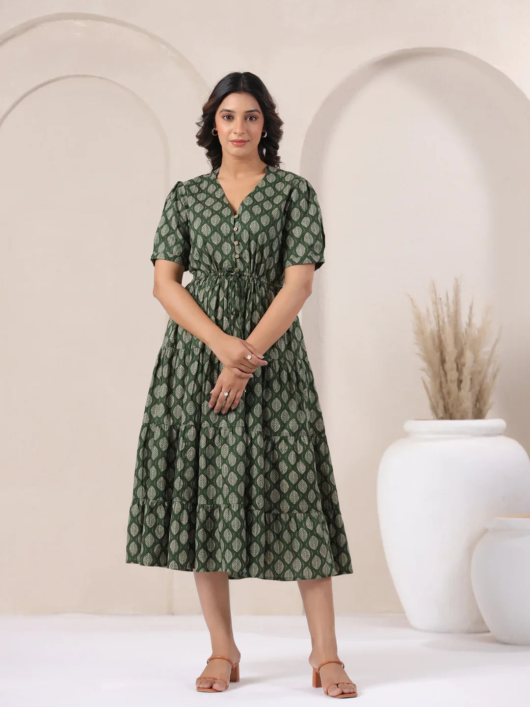 Green leaf-print cotton midi dress with puff sleeves, V-neck, and tiered skirt for women