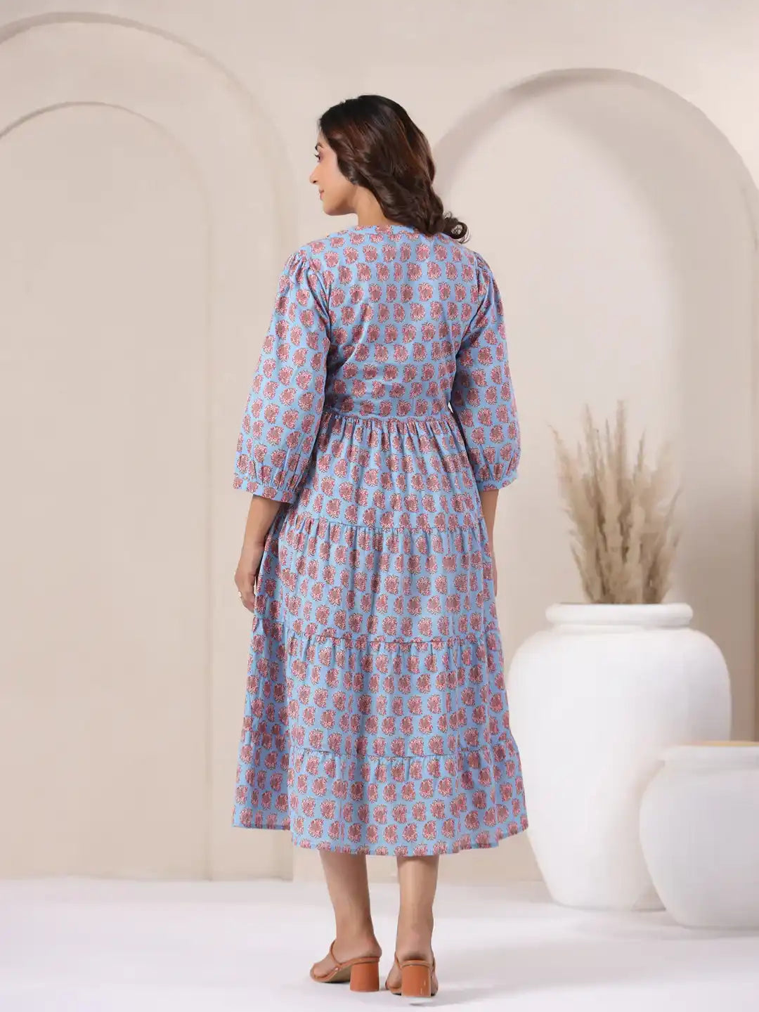 Blue cotton kurta dress with pink floral print, tiered skirt, and 3/4 sleeves for women