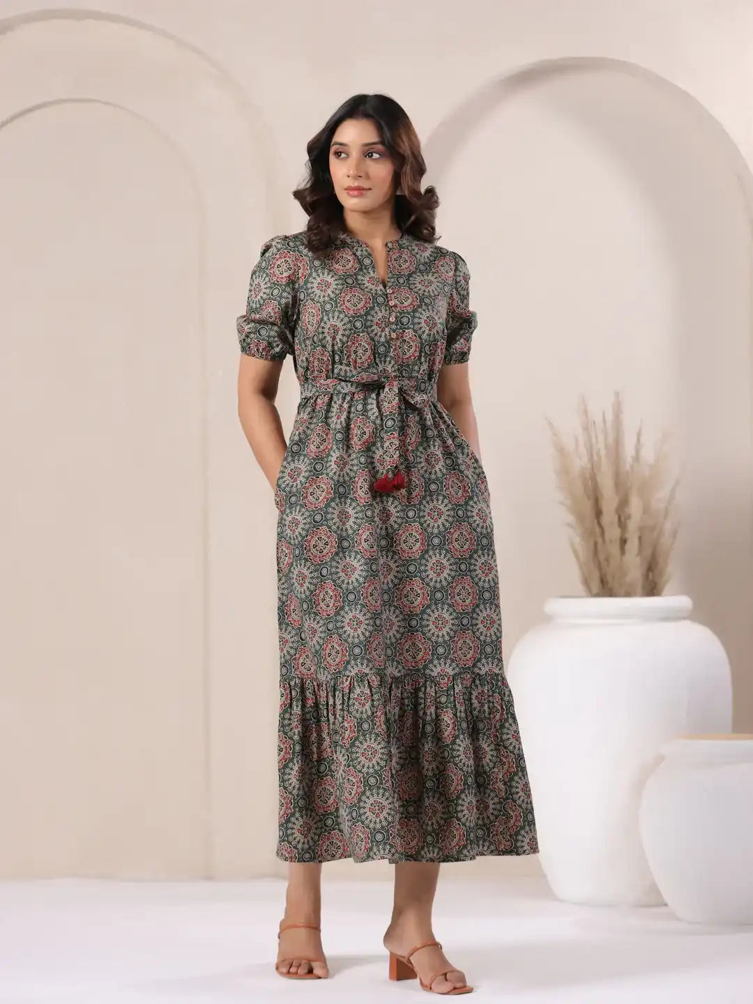 Woman in floral print cotton kurta dress with tie waist, perfect for daily wear or celebrations