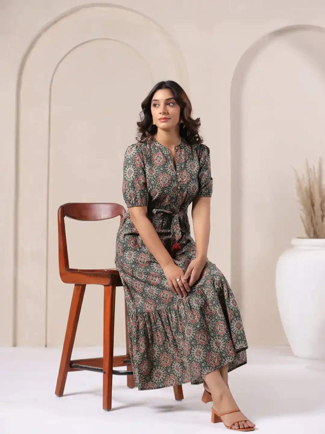 Woman in floral print cotton kurta dress, elegant daily wear with tiered skirt and tie waist
