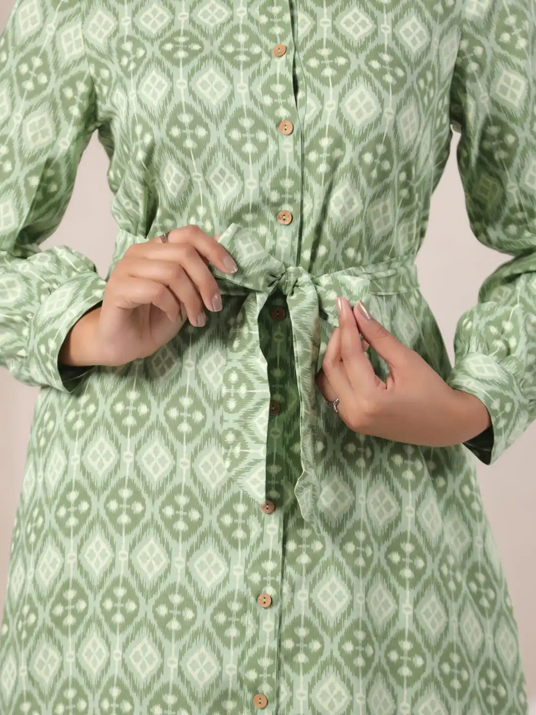Green ikat print cotton kurta with tie waist and button front, elegant women's wear