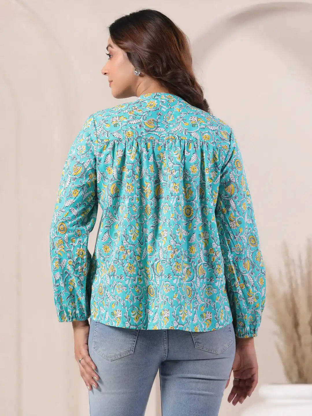 Turquoise floral print kurta with puff sleeves, paired with jeans for casual wear