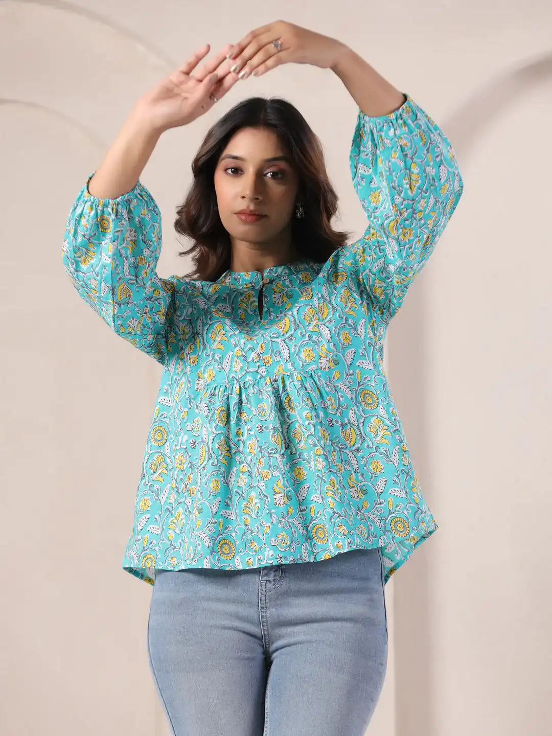 Turquoise floral print kurta with puff sleeves, paired with jeans for casual wear