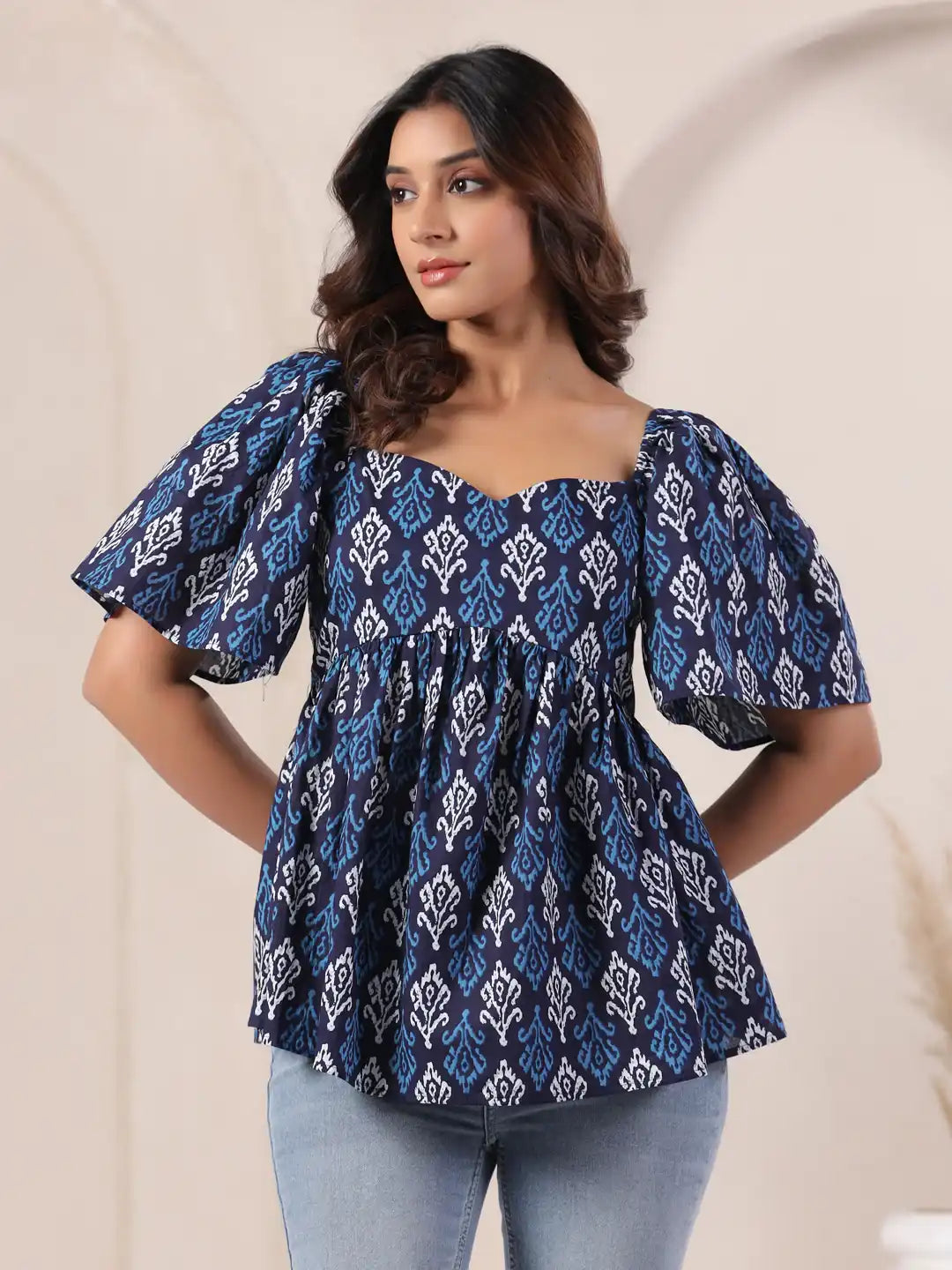 Blue and white printed cotton top with puff sleeves, perfect for daily wear or office