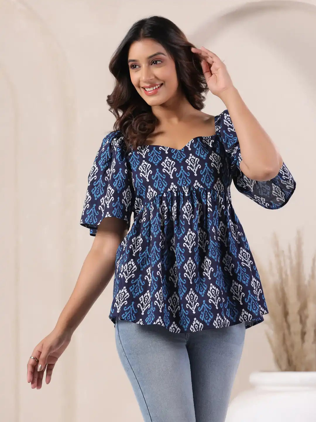 Blue and white printed cotton top with puff sleeves, perfect for casual or office wear