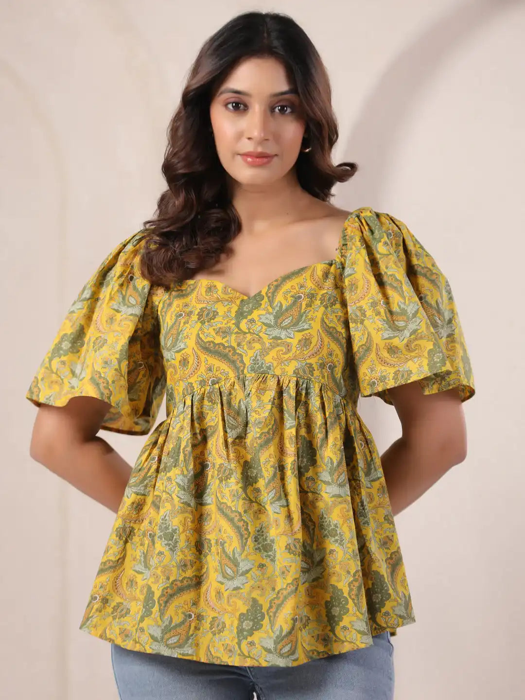 Yellow paisley print peplum top with puff sleeves, perfect for casual or office wear