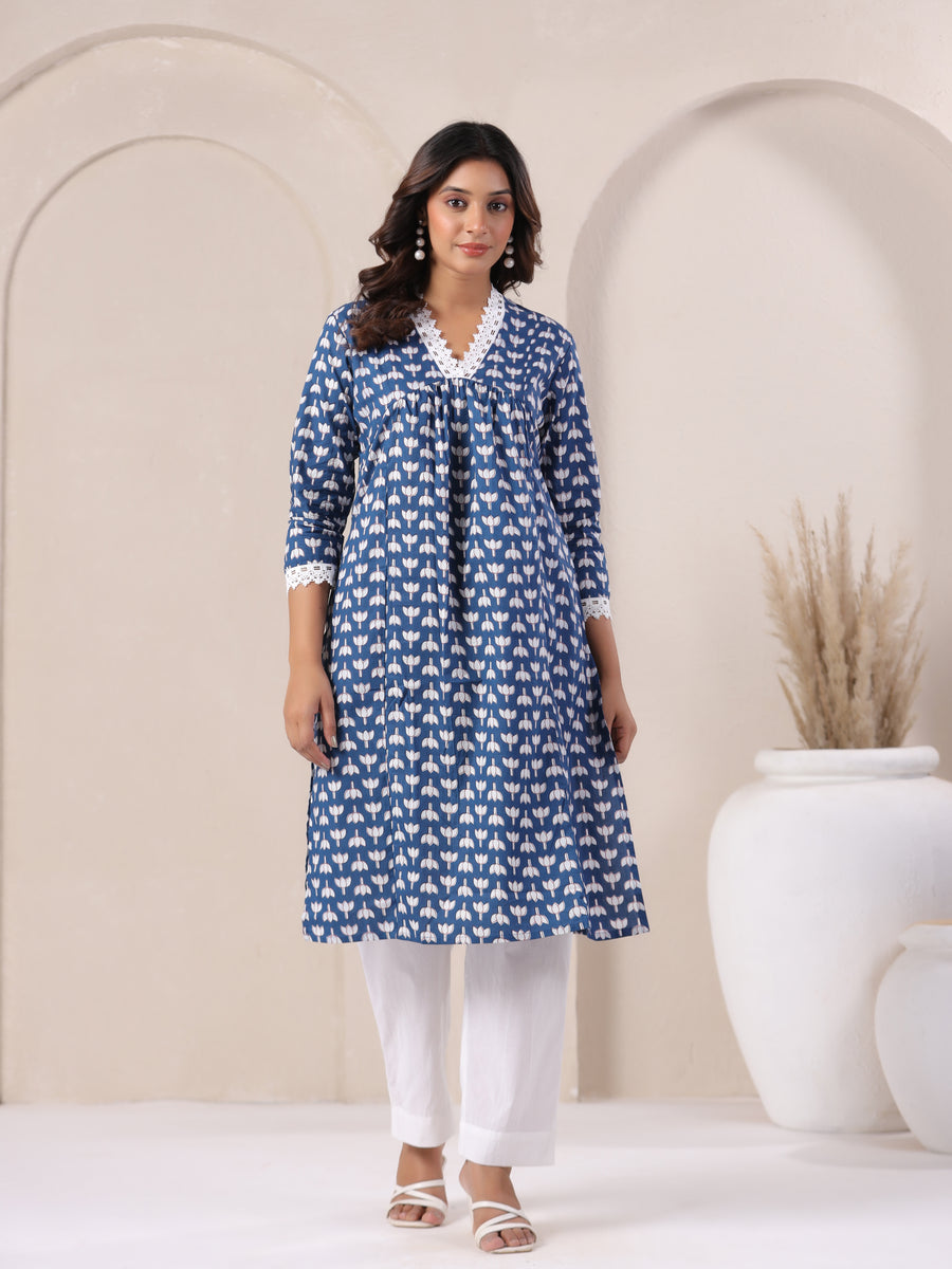 Blue floral printed cotton kurta with white lace detailing, paired with white pants for elegant daily wear