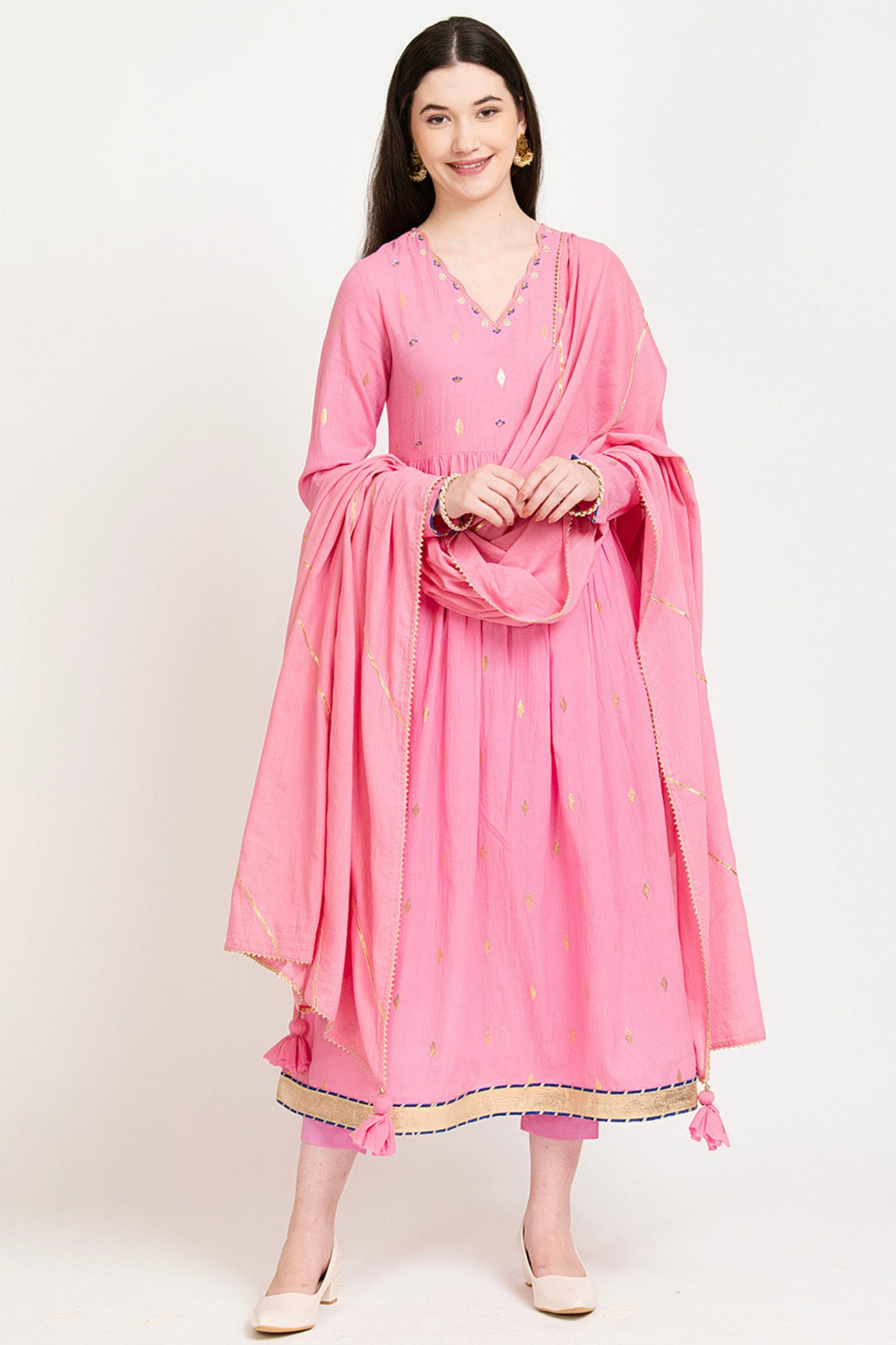 Pink cotton kurta set with gold embroidery and tassels, perfect for daily wear or celebrations