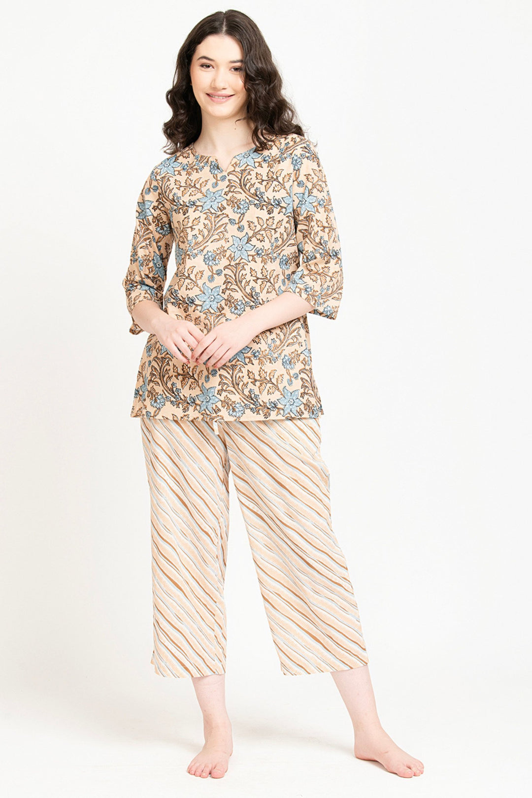 Women's floral print cotton kurta set with striped palazzo pants, elegant and comfortable for daily wear