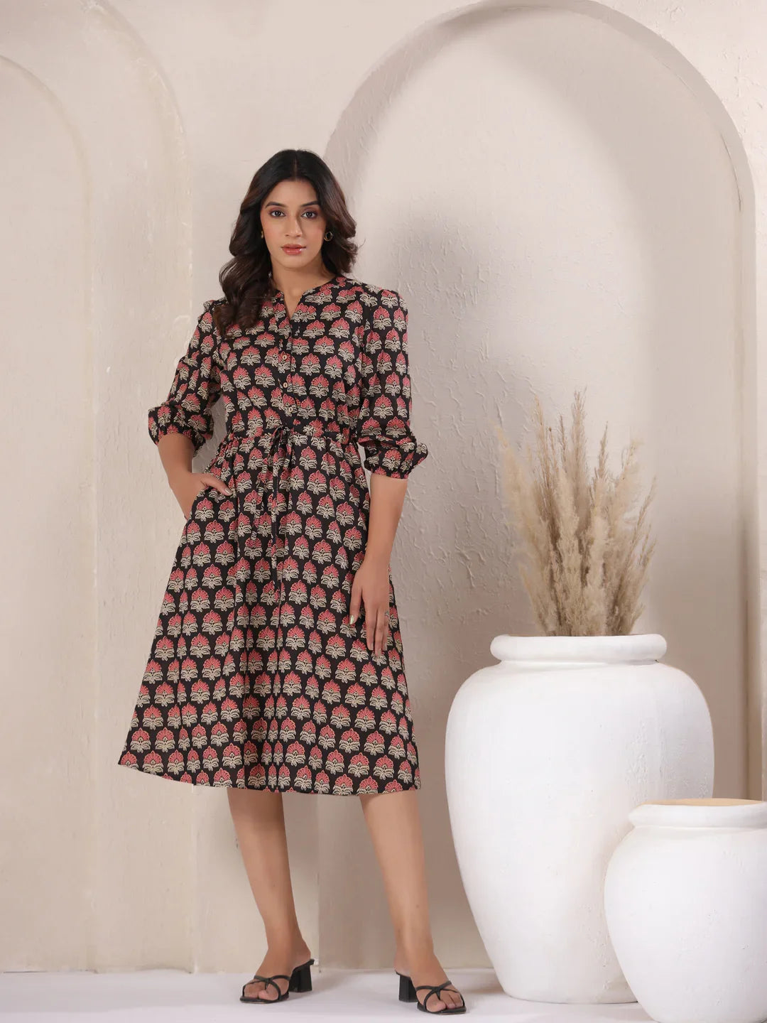 Woman in black and pink floral print cotton kurta dress, perfect for daily wear or office