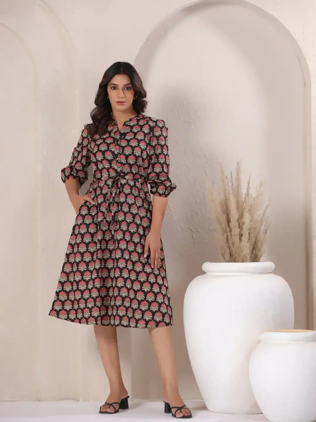 Woman in black and pink floral print cotton kurta dress, perfect for daily wear or office
