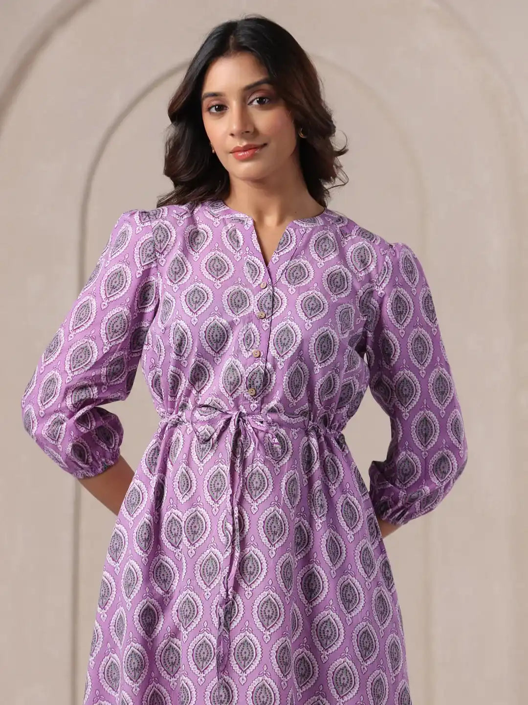 Purple printed cotton kurta with tie waist, puff sleeves, and button front for women's daily or festive wear