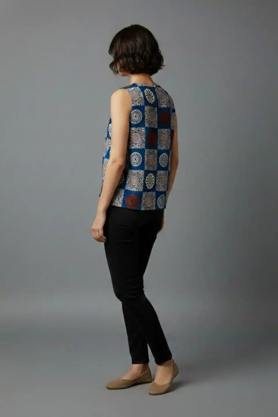 Blue patterned sleeveless kurta top with black pants, elegant cotton women's wear for daily or office use
