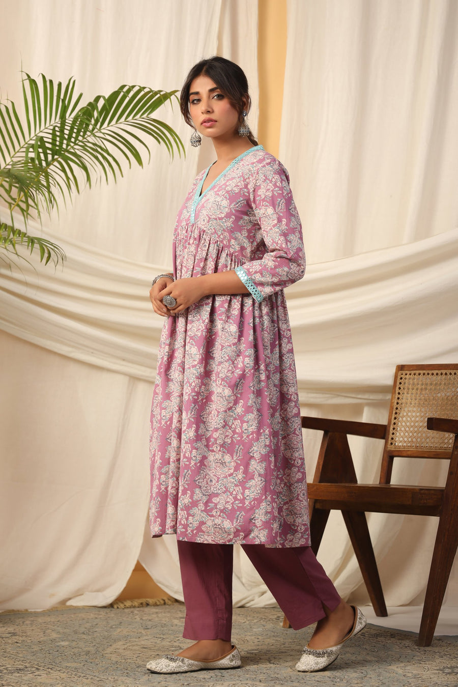 Pink floral print cotton kurta set with contrast neckline, paired with maroon pants for women