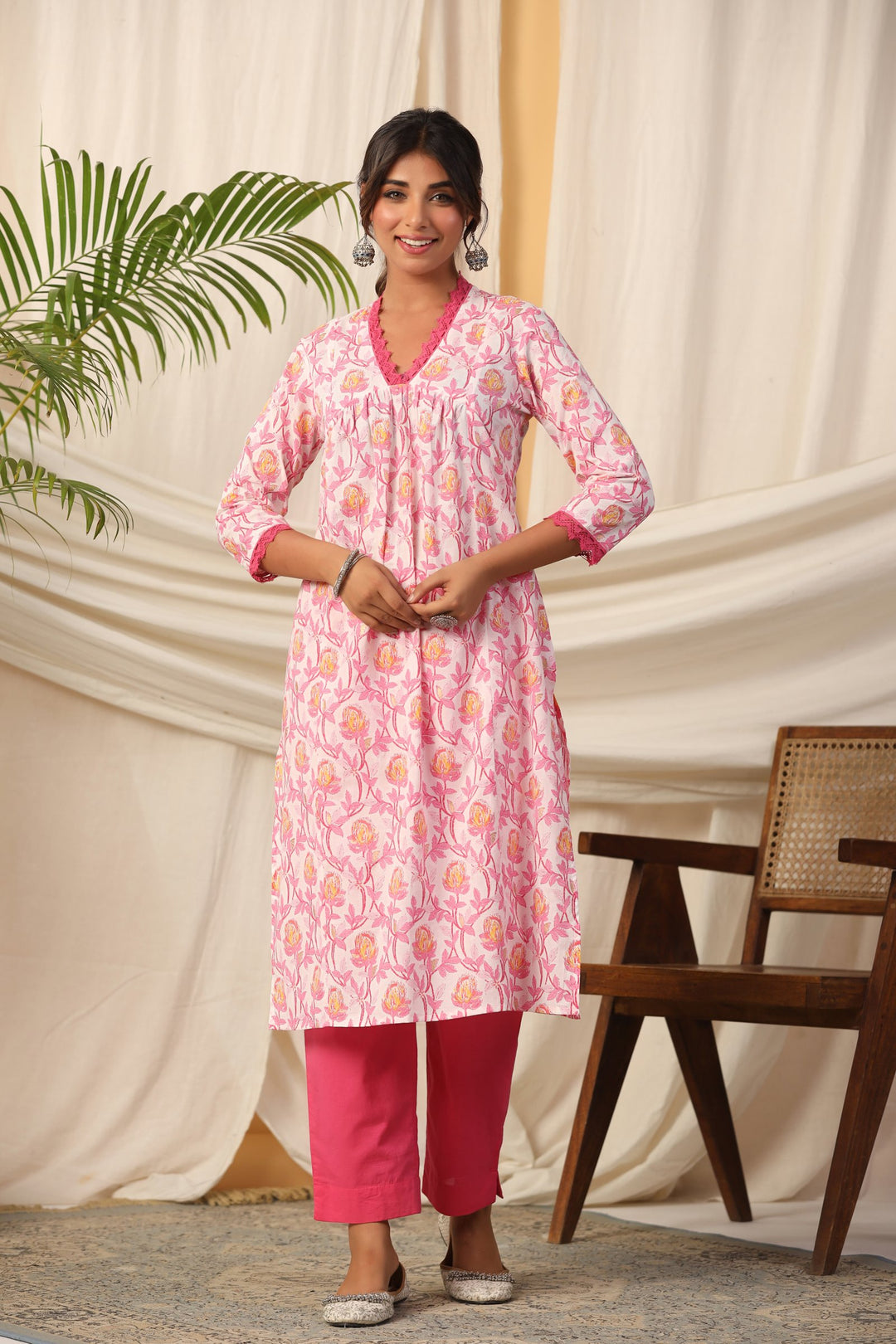 Pink floral print cotton kurta set with matching pants, elegant for daily wear or celebrations