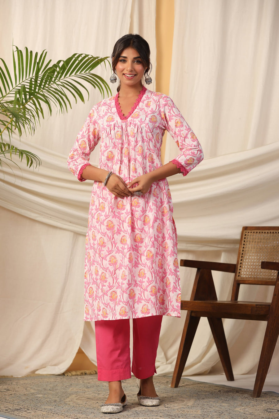 Pink floral print cotton kurta set with matching pants, elegant for daily wear or celebrations