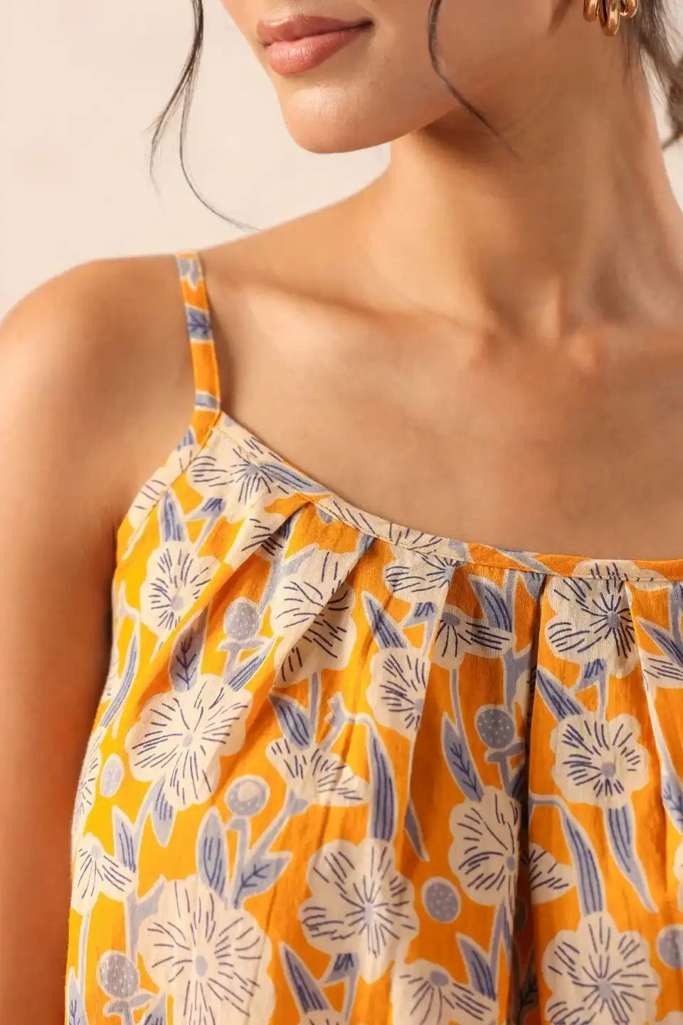 WomanwearingyellowfloralstrappytopcasualsummeroutfitSleevesdeatils - VyomTara