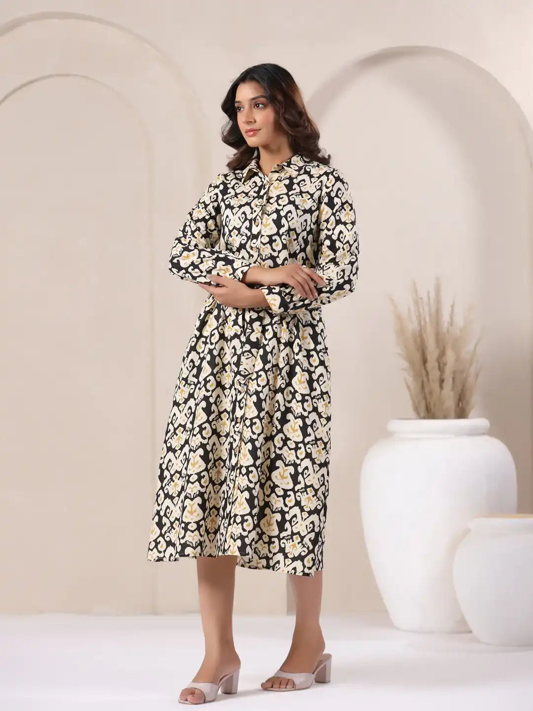 Woman in black and cream printed cotton kurta dress, elegant daily wear style