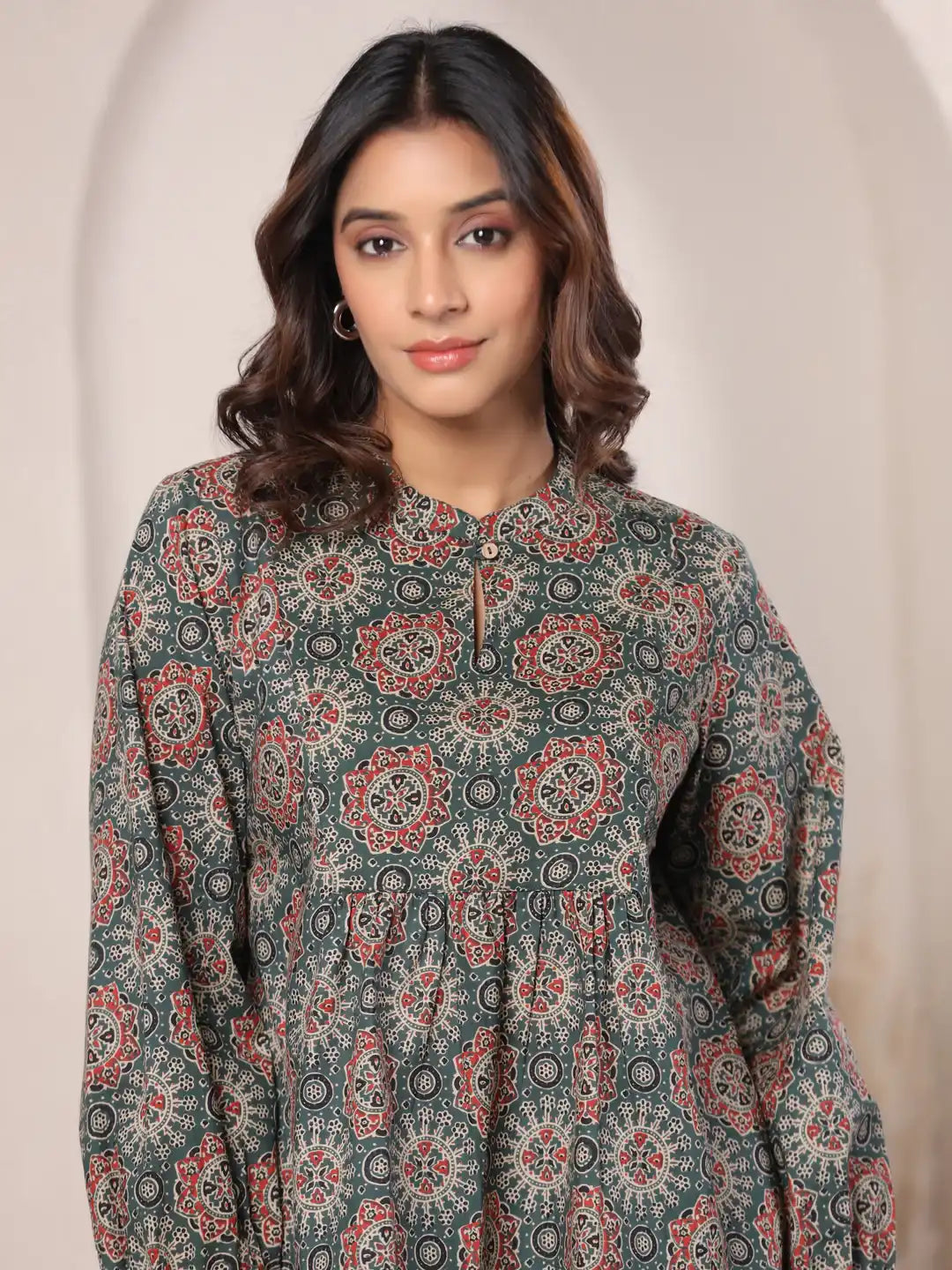Green printed cotton kurta with red and black floral motifs, elegant daily wear for women
