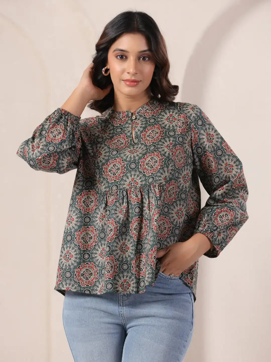 Woman wearing printed cotton kurta with puff sleeves, paired with jeans for casual wear