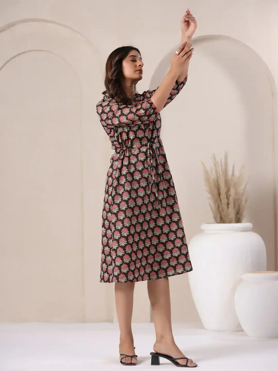 Woman in elegant cotton kurta dress with pink floral print, perfect for daily wear or office